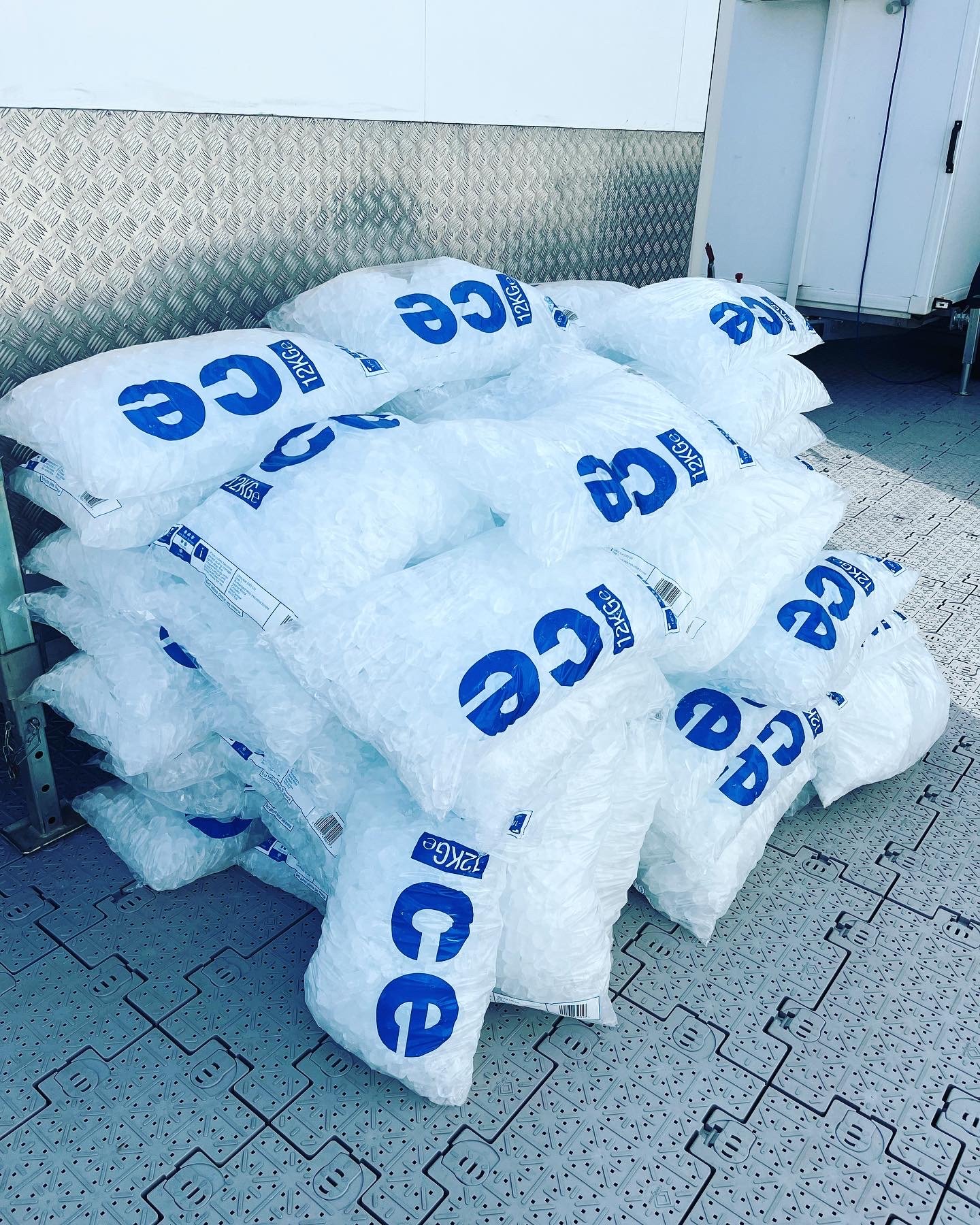 Pile of 12kg cubed ice bags ready for delivery